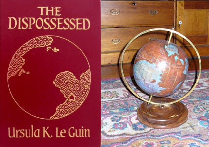 Red hardcover of Le Guin's The Dispossessed & handcrafted glove of the planet Anarres