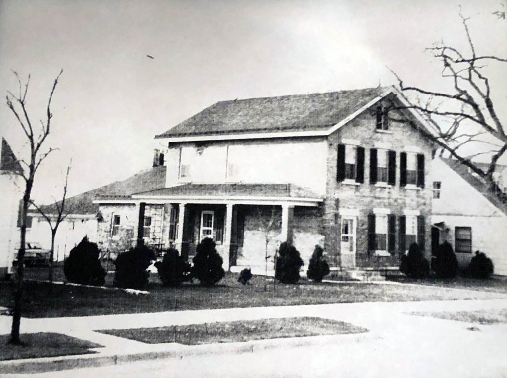 Cream brick farmhouse ca 1956